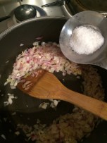 Add salt to cook onion faster.