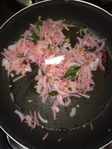 Add salt and half cook the onions.