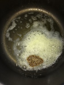 Add cumin and let them crackle.