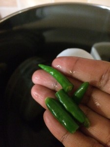 First add the green chilies to the grinder and let it grind the chilies well.