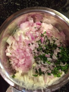 Add the chopped onion,curry leaves & coriander leaves to the batter.