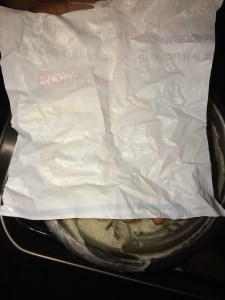 Cut a plastic sheet in the shape of a square, that fits the palm of your left hand. Apply the water on the seet and hold the sheet on the palm of the left hand.