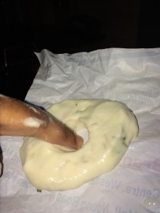 Dip your forefinger in the water and make a small hole in the middle.