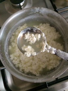 Now all the milk has curdled and we can see the whey water that is light green in colour.