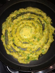 Heat a non stick tawa and make a dosa using the batter. Spread a tsp. of oil.
