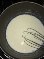 Use a whisk to get a lump free sauce.