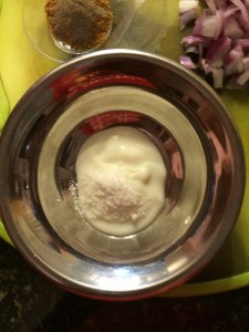 Take yogurt/curd and salt in a bowl.