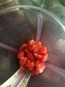 Blend the tomatoes in a blender.