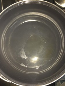 Take oil in a vessel.