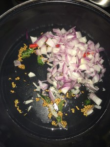 Time to add the green chilies and the onion. ( I have taken a red colour chili)