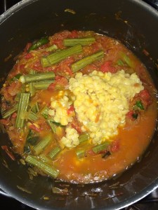 Finally add the cooked toor dal and water to the dish.