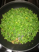 Now add the peas to the pan.