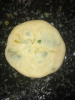 Finally flatten the dough again by pushing the filling to the corners. 