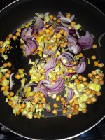 Now add sliced onion, ginger, garlic and fresh turmeric and roast for a while.