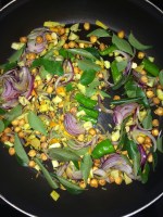 Now add the green chilies and curry leaves and saute everything for a while.