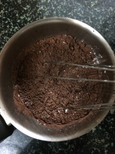 Add all the ingredients in a saucepan except the butter and vanilla, whisk everything together.