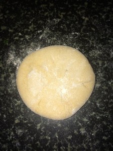 Flatten the dough (with the stuffing using your fingers spreading the stuffing evenly to the corners of the dough.