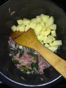 After the onions become translucent add the chopped potato. Saute for few mins.
