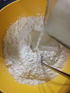 Now add the yeast mixture into the flour.