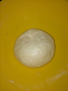 Take a bowl and spread little olive oil on the inside and over the dough and place the dough inside it.