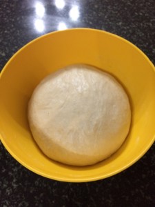 After one hour the dough has doubled in size.Now punch down the air and the dough is ready to make pizzas.