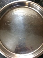 Take a plate according to the thickness you want and grease it with oil or ghee and set aside. 