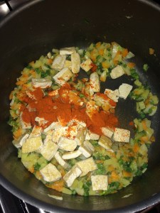 After that add the tofu and red chili powder.