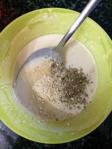 Now add garlic powder and oregano to the mixture.