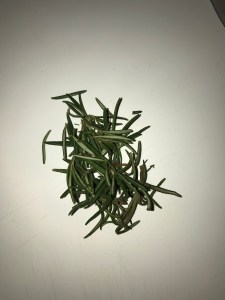 Remove the leaves from the stem of the Rosemary.