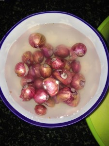 Cut the top and bottom of the shallots and put them in water for 5 mins. for easy peeling.