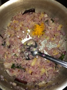 Then add turmeric powder. Saute unti lthe raw smell goes off.